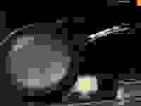 The Anolon X frying pan on an electric cooktop