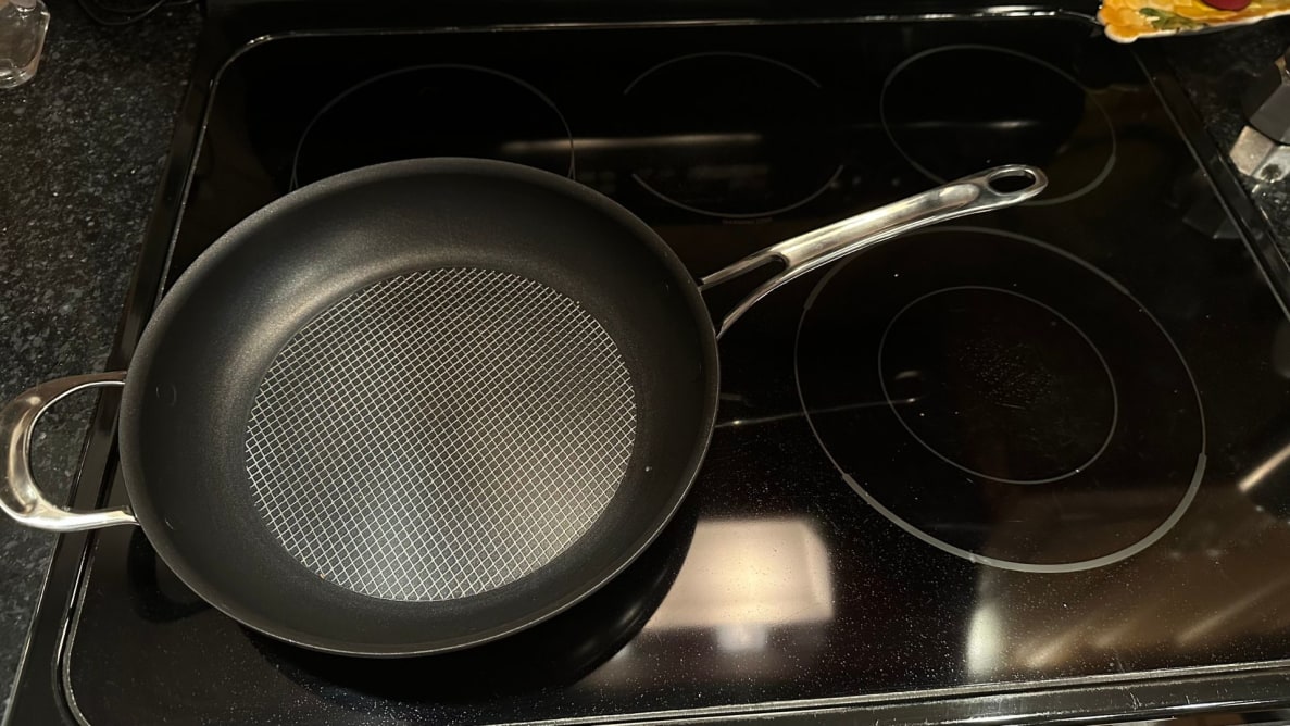 The Anolon X frying pan on an electric cooktop