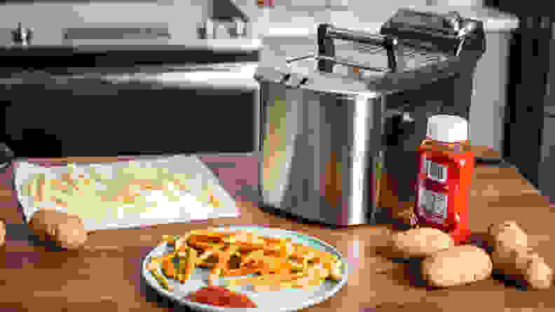 A Breville deep fryer sits on a kitchen counter.