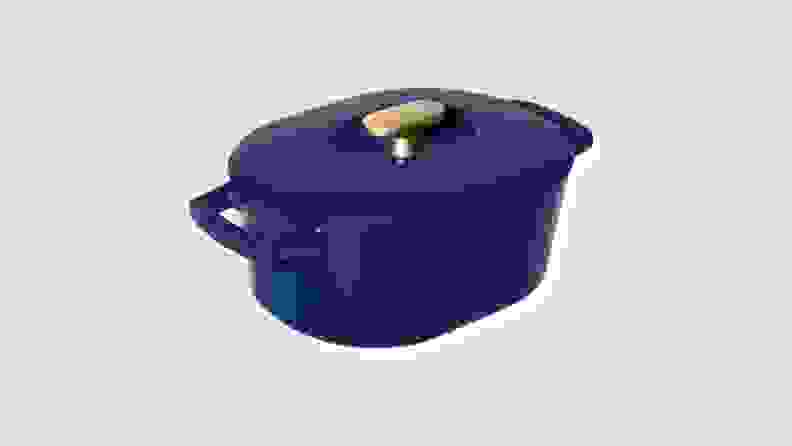 Product shot of navy colored dutch oven from the Beautiful by Drew Barrymore Kitchen Appliances line.