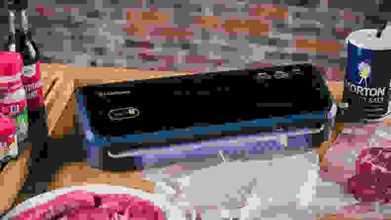 Vacuum sealer sitting on a table.