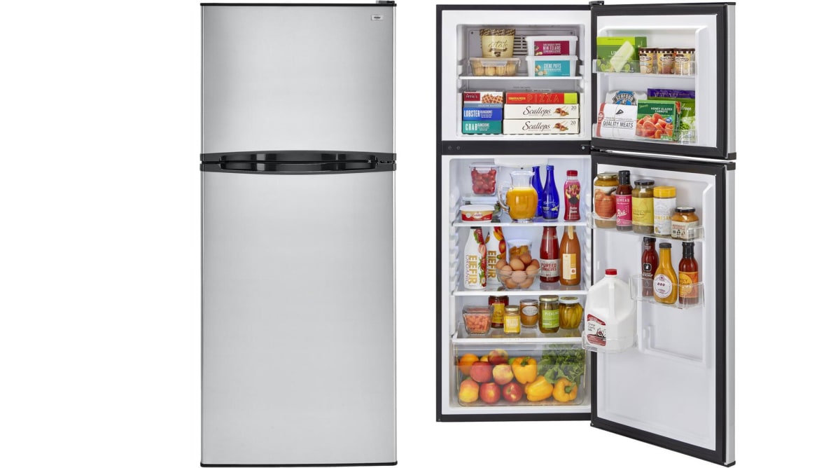 Two Haier fridges float in a white void. The leftmost has its door closed, showing off its stainless steel exterior and black-plastic pocket handles. The rightmost version has its door open, showcasing fully-stocked shelves.
