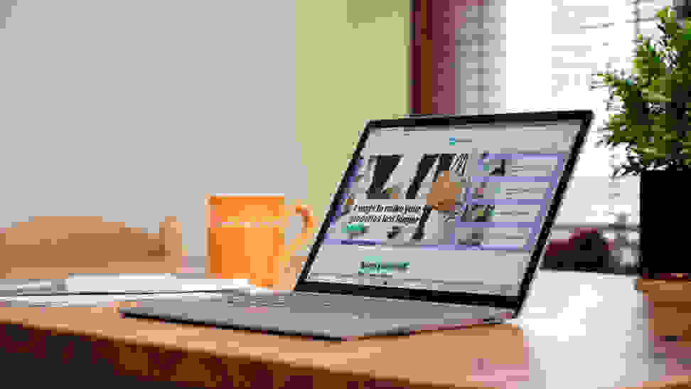 An open and powered on laptop displaying a website on its screen