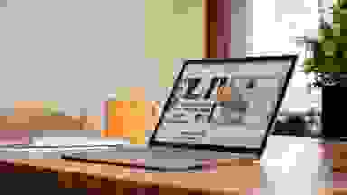 An open and powered on laptop displaying a website on its screen