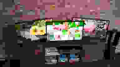 A trio of 32-inch TVs on a table