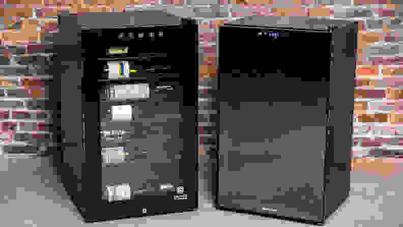 The Vinotemp 42-bottle and WineEnthusiast 32-bottle fridges side-by-side against a brick wall.