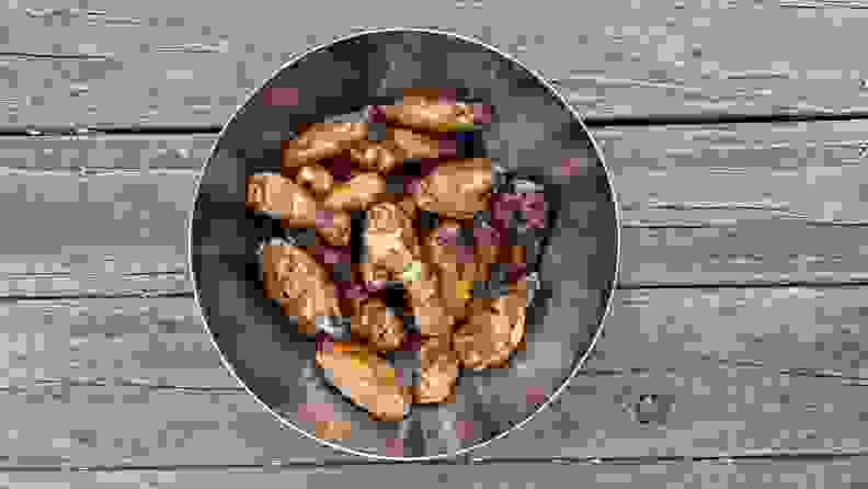 Smoked chicken wings inside a silver bucket.