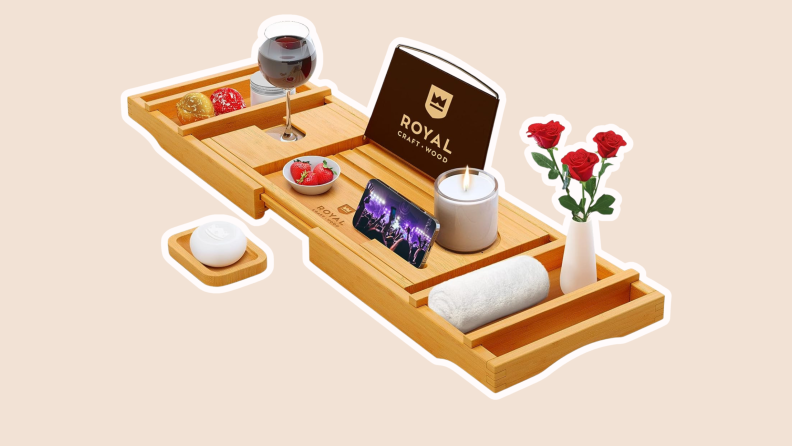 A bamboo Royal Craft Bath Tray features places for food, wine, smart phone and much more.