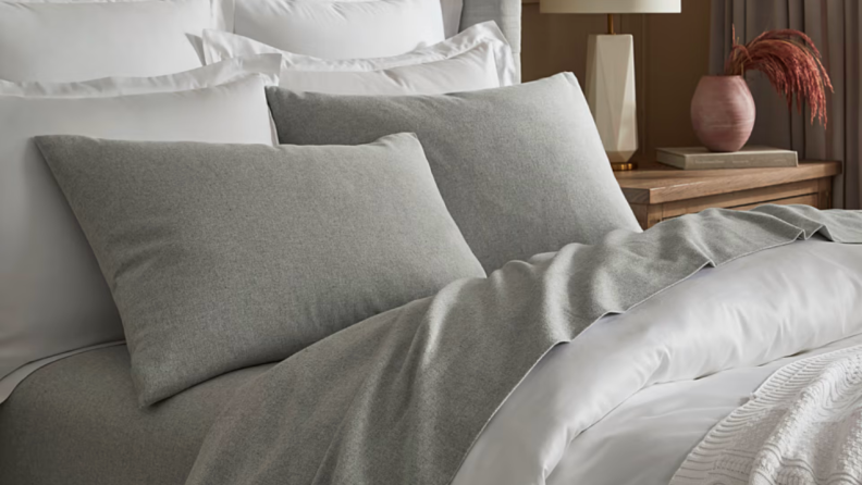 Gray flannel Boll and Branch sheets—the best sheets made of flannel that we tested—appear on a well-made bed.