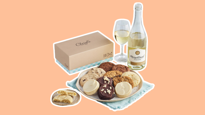A plate of assorted cookies and a bottle of white wine featured in a Harry & David gift basket.