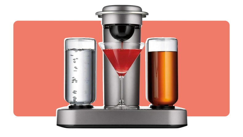 The Bartesian Premium Cocktail and Margarita Machine dispensing a cocktail into a martini glass.