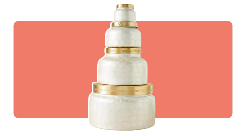 A stack of four Capri Blue candle jars in ascending order of sizes.