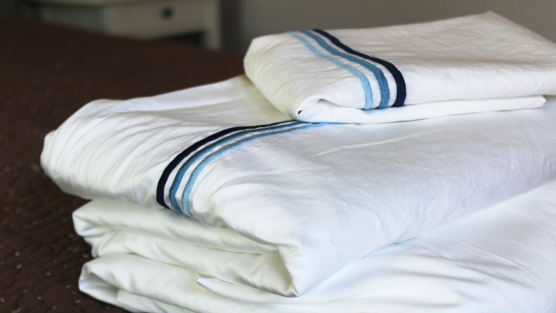 Blue details ornament these sateen sheets from Pure Parima—the best bed sheets we tested.