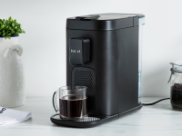 Product shot of the Instant Dual Pod Plus Coffee Maker on granite countertop in kitchen.