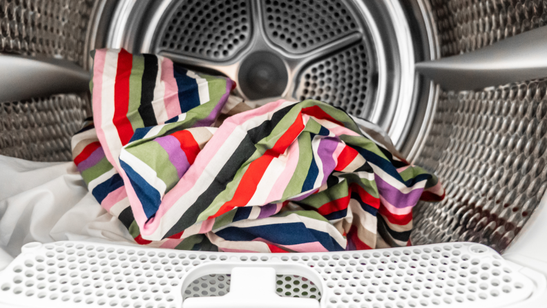Colorful clothes inside of dryer drum