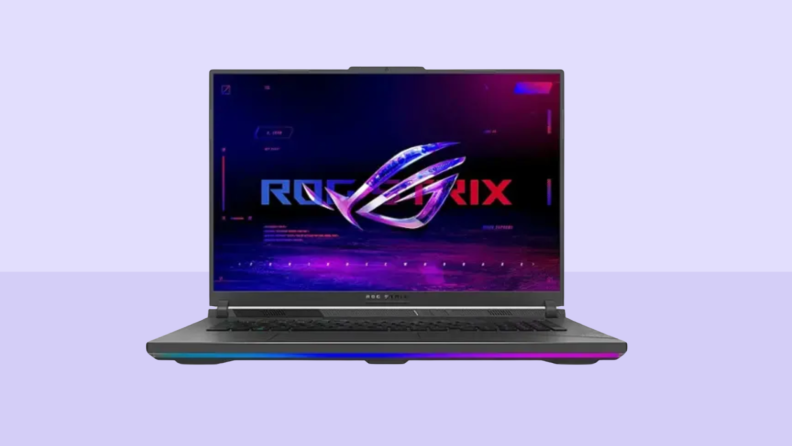 An Asus ROG Strix G18 sits on a dual-tone purple background