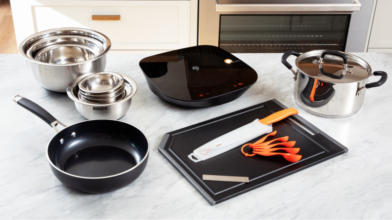The full Tramontina Guru set laid out on display on a countertop.