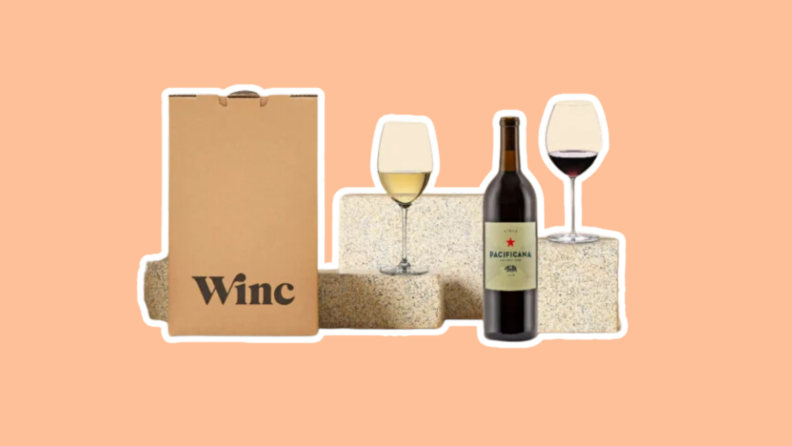 A bag from Winc next to two glasses of wine and a single bottle of wine on diplay pillars.